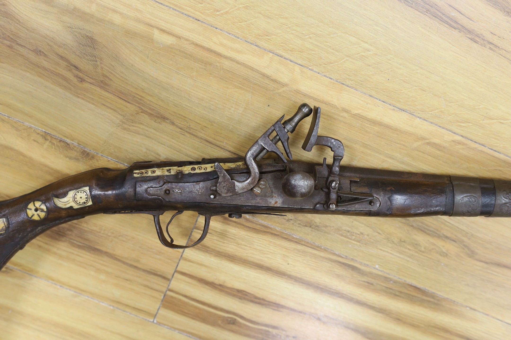 An Eastern antique flintlock rifle - 152cm long